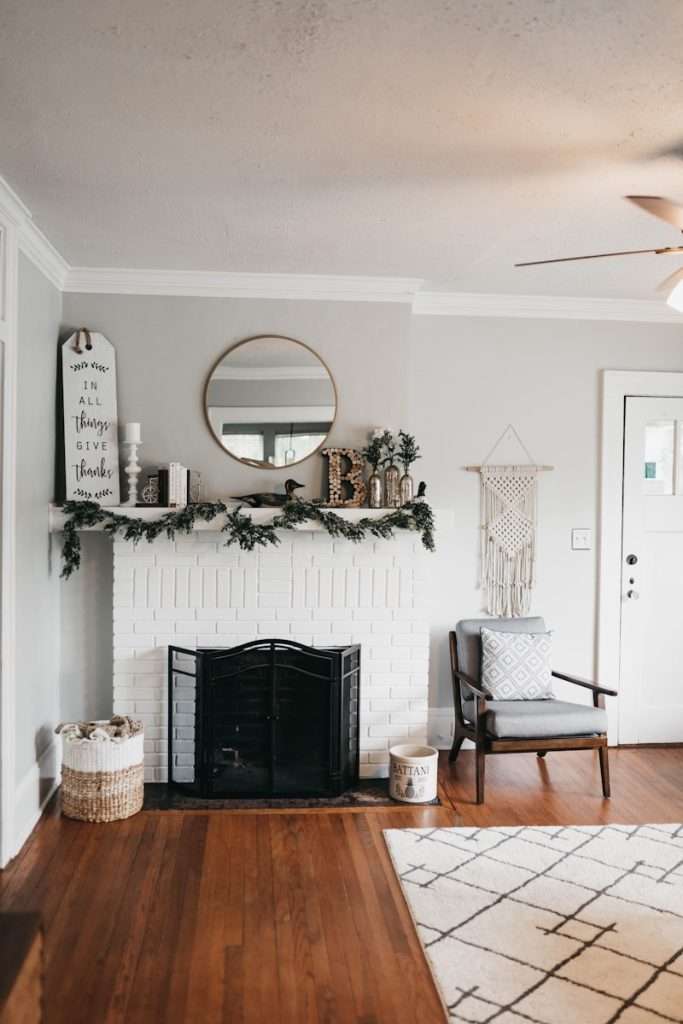 white fireplace mantel with decors